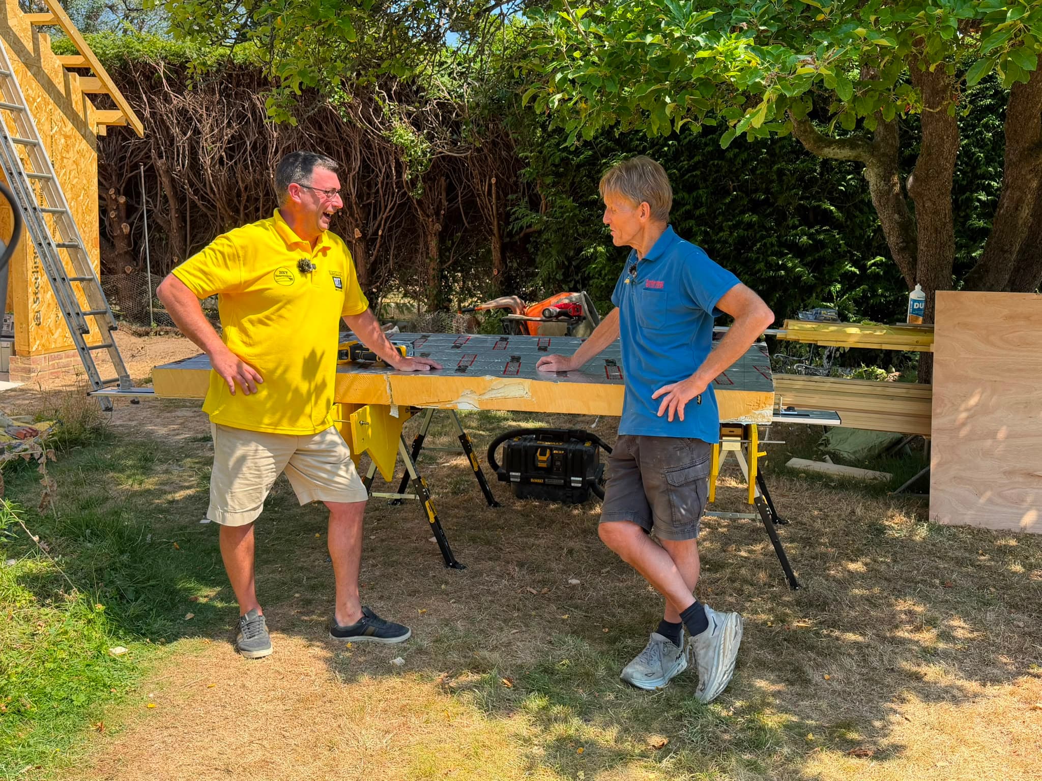 Jody Baxter demonstrating SlideGuide to Roger Bisby of SkillBuilder, with a PIR board set up for cutting on trestles
